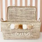 Personalized Moroccan Chest with Tassels – Handwoven Palm Leaf Storage Trunk in Ecru, Camel & Nude