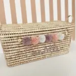 Personalized Moroccan Chest with Pompoms – Handwoven Palm Leaf Storage Trunk in Lilac, Vintage Pink & Beige