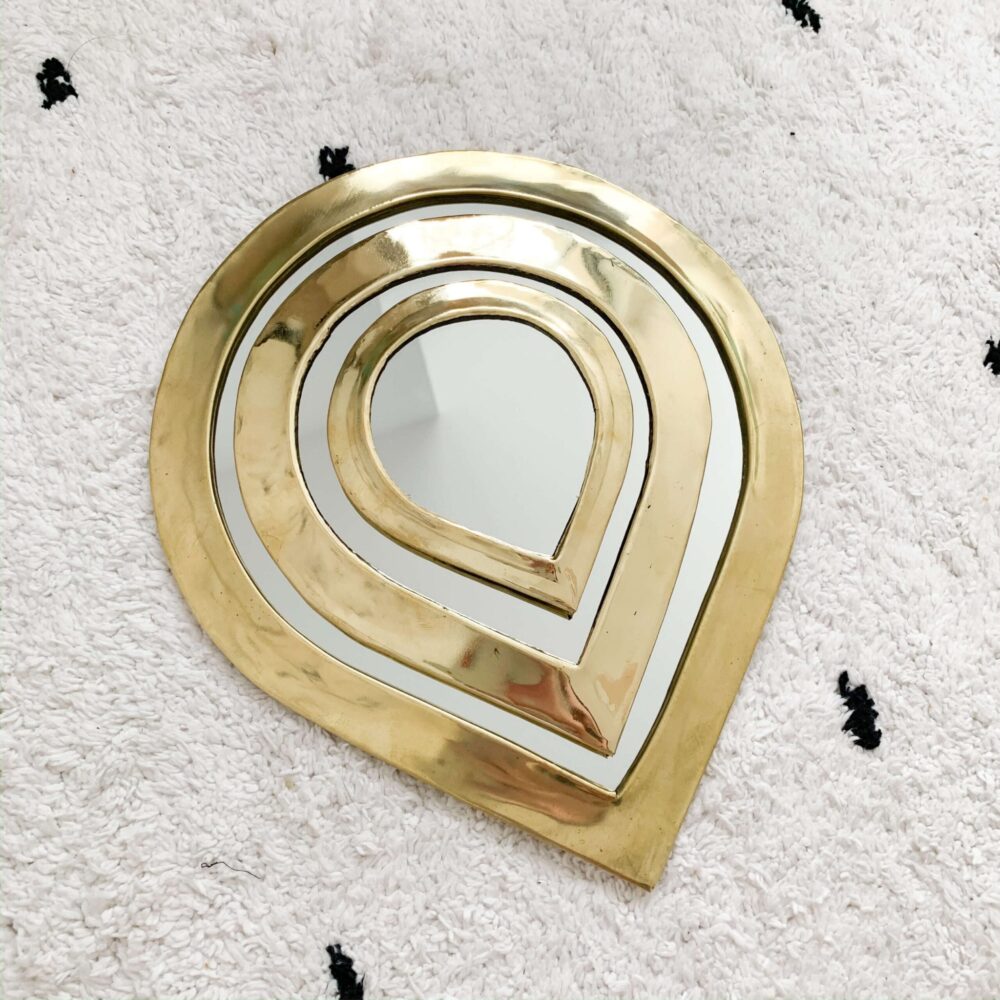 Handmade drop-shaped brass mirror, available in three sizes, crafted in Morocco, featuring a sleek brass frame, ideal for modern, bohemian, and minimalist home decor.