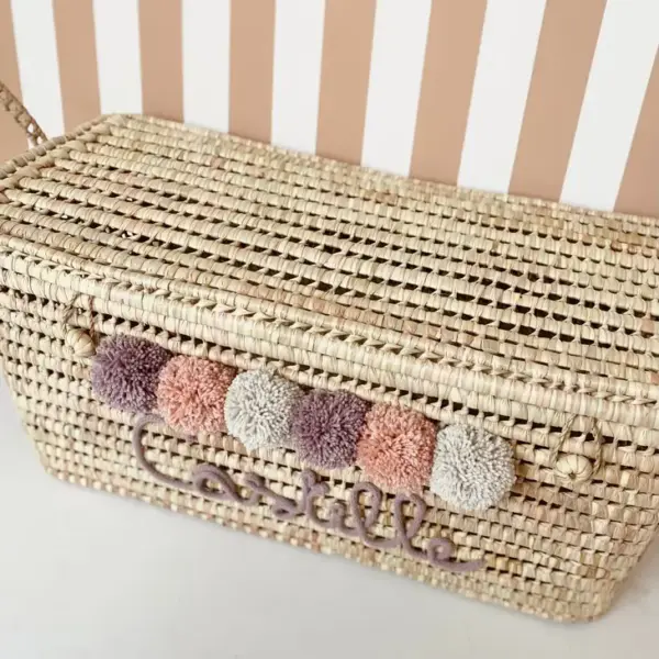 Personalized Moroccan Chest with Pompoms – Handwoven Palm Leaf Storage Trunk in Lilac, Vintage Pink & Beige
