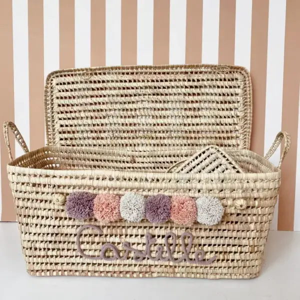 Personalized Moroccan Chest with Pompoms – Handwoven Palm Leaf Storage Trunk in Lilac, Vintage Pink & Beige
