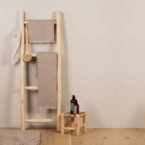 Rustic-wooden-ladder-towel-rack-with-bathroom-accessories-and-woven-stool-768×768