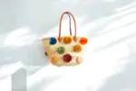 Straw Bag with Pom Poms and Leather Handles – Handcrafted Moroccan Raffia Tote