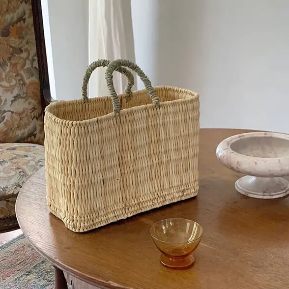 1f4fb6bf45bb7af4d2ff1963d424c264ff1033b5864f86714123bb15f7b6cdfd.webp Medina Tassel Basket - Handwoven Rattan Bag | Moroccan Boho Tote
