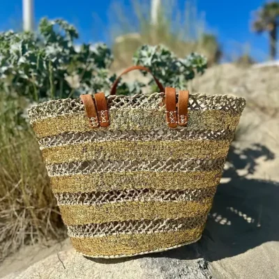 5191310dca04e16111361d3e7c70cbbc1b3b89ffb6c5bfc15fd64e534b50a8bf-1.webp Sequin Basket – Handwoven Doum Palm Fiber Tote with Leather Handles & Drawstring Closure