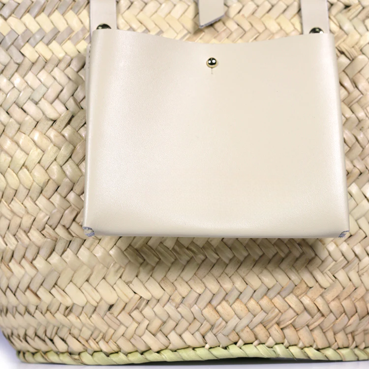 7d3a08859af6074e4b3561a9edce94454d5d6c412904a5a10abd02e0df1b848c-1-1.png Cream Basket – Handwoven Doum & Off-White Leather Summer Tote