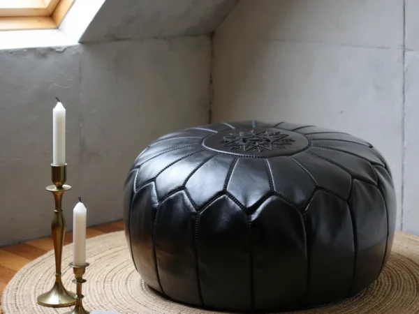 Handcrafted-Moroccan-Leather-Pouf-Black-in-Black-4.webp Black Moroccan Leather Pouf – Handcrafted Round Ottoman with Tone-on-Tone Stitching (21″ × 12″)