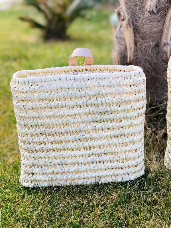 ca152c3b22fae3dd3eed51025fe7b88b605d9e3184bd65ea1f1e0ffcdb5eefa0-1.webp Duo of Palm Fiber & Leather Baskets | Handwoven Moroccan Wall Storage