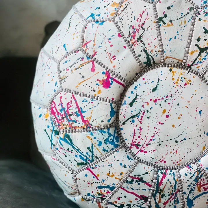 ce9ee422bea1712aaffcd9effae5d5a56e6a564a45d7b36786024a2123515710.webp Rainbow Moroccan Round Leather Pouf 🌈✨