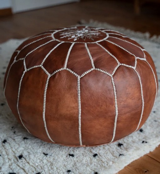 moroccan-leather-pouf-cognac-brown-on-rug.jpg Handcrafted Leather Pouffe – Cognac Brown Moroccan Ottoman