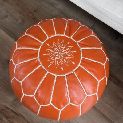 orange-moroccan-leather-pouf-close-up.jpg Leather Pouffe – Orange and White | 55x35 cm Handcrafted Round Ottoman