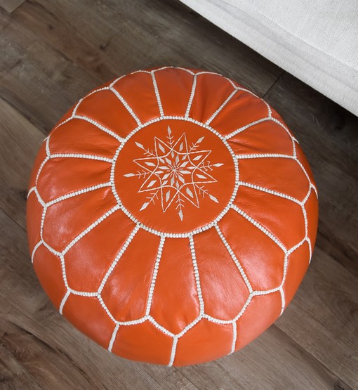 orange-moroccan-leather-pouf-close-up.jpg Leather Pouffe – Orange and White | 55x35 cm Handcrafted Round Ottoman