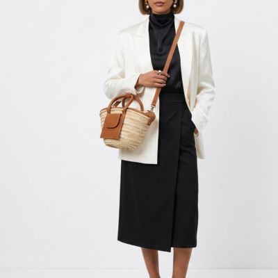Moroccan Straw Basket Bag Leather Handles Convertible Tote Crossbody Handbag Palm Leaf Market Bag Pocket Boho Beach Bag Gift for Her (2) Woman carrying large handwoven Moroccan palm leaf straw basket tote with leather handles and front pocket, styled with linen blazer