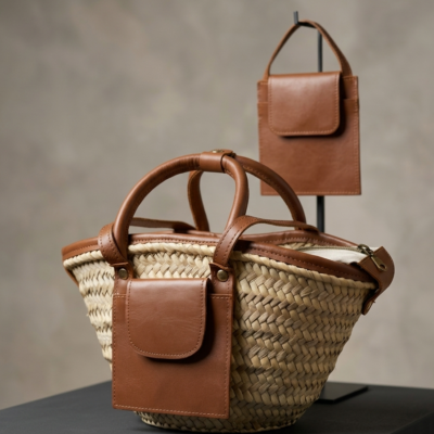 Moroccan Straw Basket Bag Leather Handles Convertible Tote Crossbody Handbag Palm Leaf Market Bag Pocket Boho Beach Bag Gift for Her (9) Close-up of Moroccan straw basket bag showing genuine leather front flap pocket, short top handles and long convertible crossbody strap