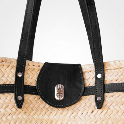 Handwoven Moroccan palm leaf straw shoulder bag with leather trim, long straps, front turn-lock pocket and silver hardware, boho market tote held by hand