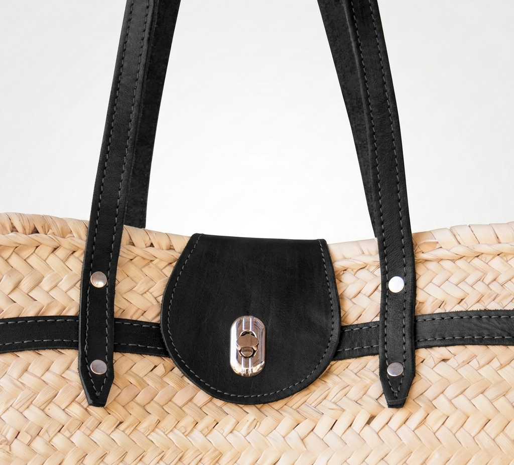 Handwoven Moroccan palm leaf straw shoulder bag with leather trim, long straps, front turn-lock pocket and silver hardware, boho market tote held by hand
