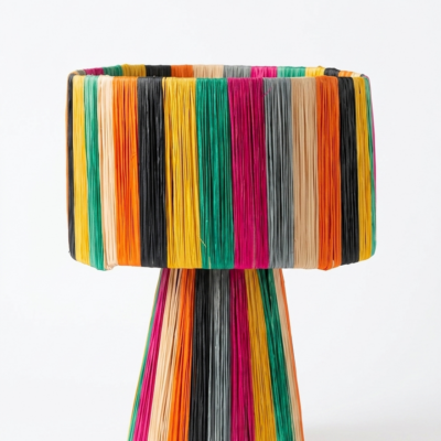 Handmade Moroccan multicolor raffia mushroom table lamp with bold rainbow stripes in teal, yellow, orange, fuchsia, black and grey, wide drum shade on tapered cone base