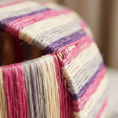 Handmade Moroccan raffia mushroom table lamp with pink grey and natural striped weave on solid square wood base, boho artisan desk light on terrazzo surface