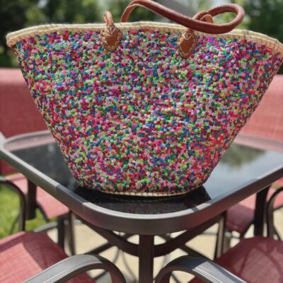 il_1140xN.7576514192_p4ih Large handwoven Moroccan straw beach tote bag with all-over multicolor sequin pompom confetti weave, natural braided palm rim, decorative leather anchor tabs and tan leather top handles