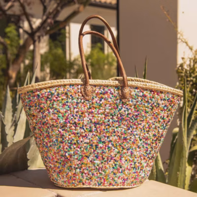 il_1140xN.7624460223_7hjh Large handwoven Moroccan straw beach tote bag with all-over multicolor sequin pompom confetti weave, natural braided palm rim, decorative leather anchor tabs and tan leather top handles