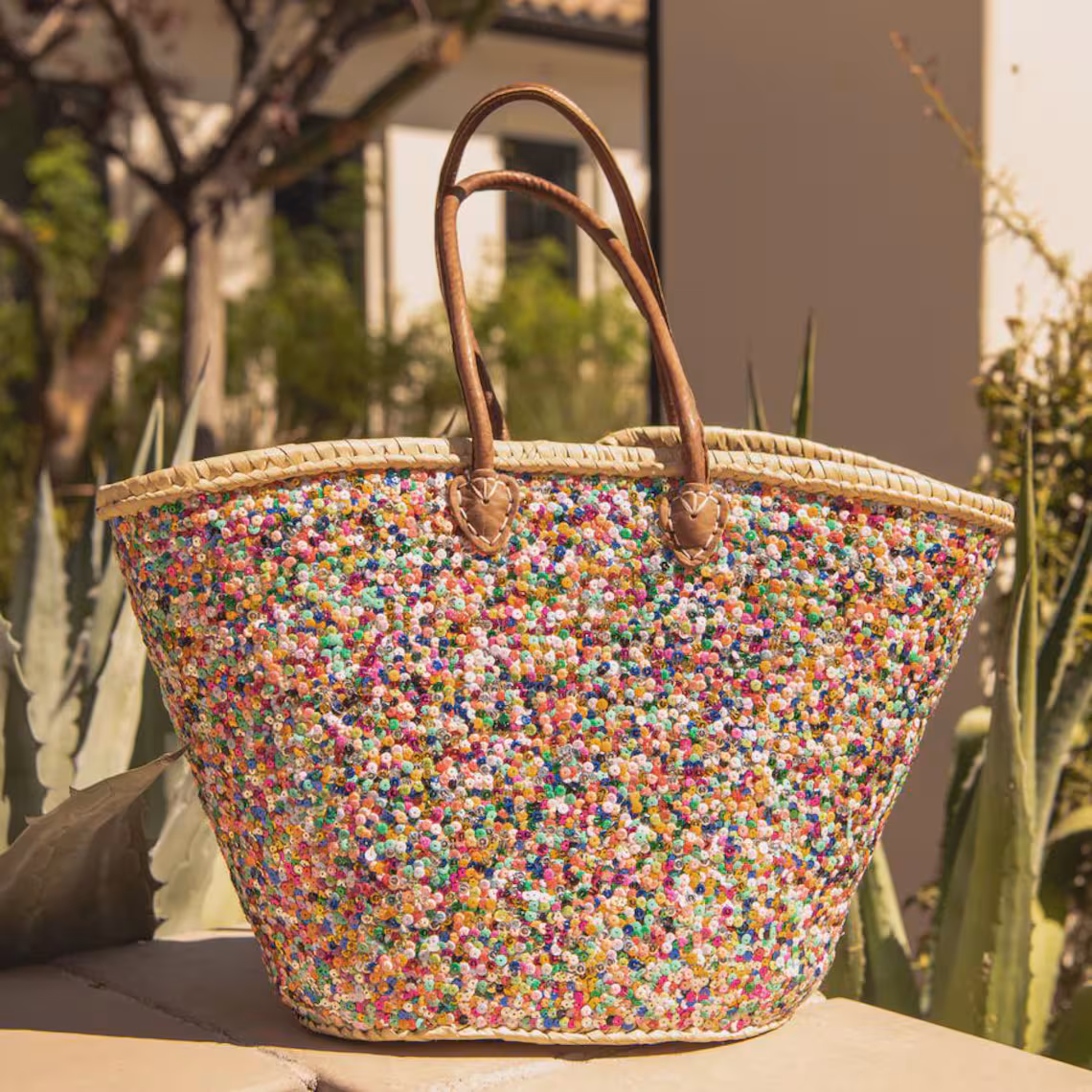il_1140xN.7624460223_7hjh Large handwoven Moroccan straw beach tote bag with all-over multicolor sequin pompom confetti weave, natural braided palm rim, decorative leather anchor tabs and tan leather top handles